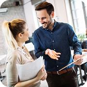 Professional colleagues discussing project details, fostering Investor Trust in their work.