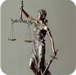 Bronze Lady Justice statue with scales and sword, representing the legal obligation for sec filing and balanced judgment.