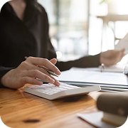 Business professional performing calculations, reviewing financial documents for strict Regulatory Oversight and compliance.