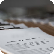 Organized documents in file folders, including important paperwork for compliance and regulatory scrutiny.